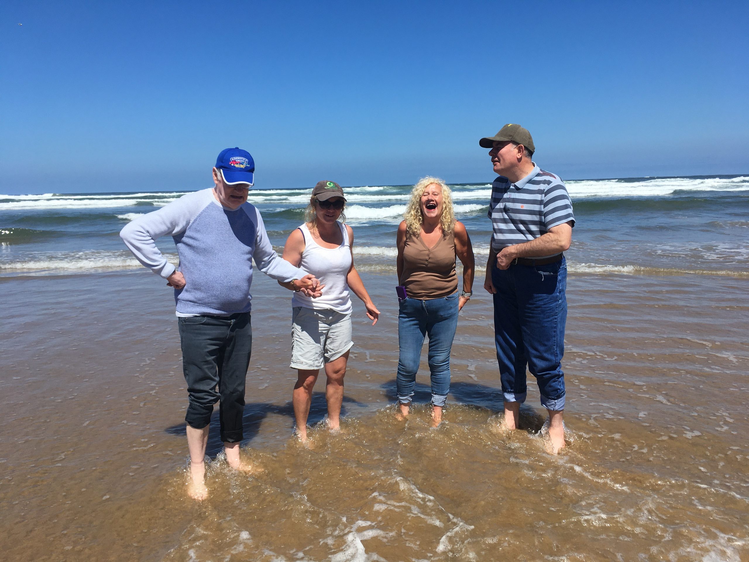 A group of people paddling in the sea